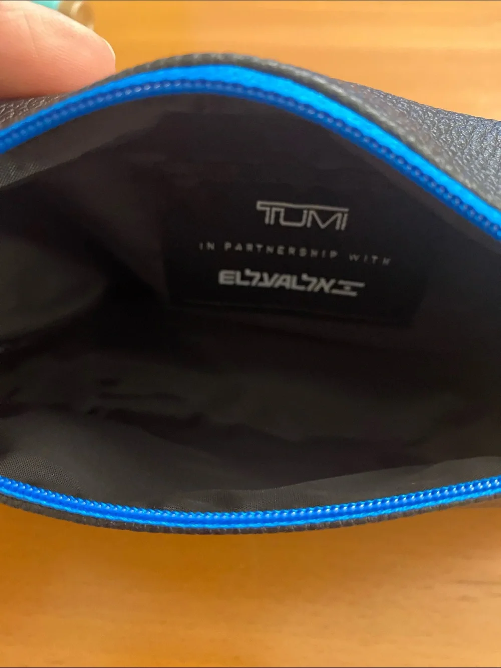 TUMI Woman’s Cosmetic Black and Blue Bag